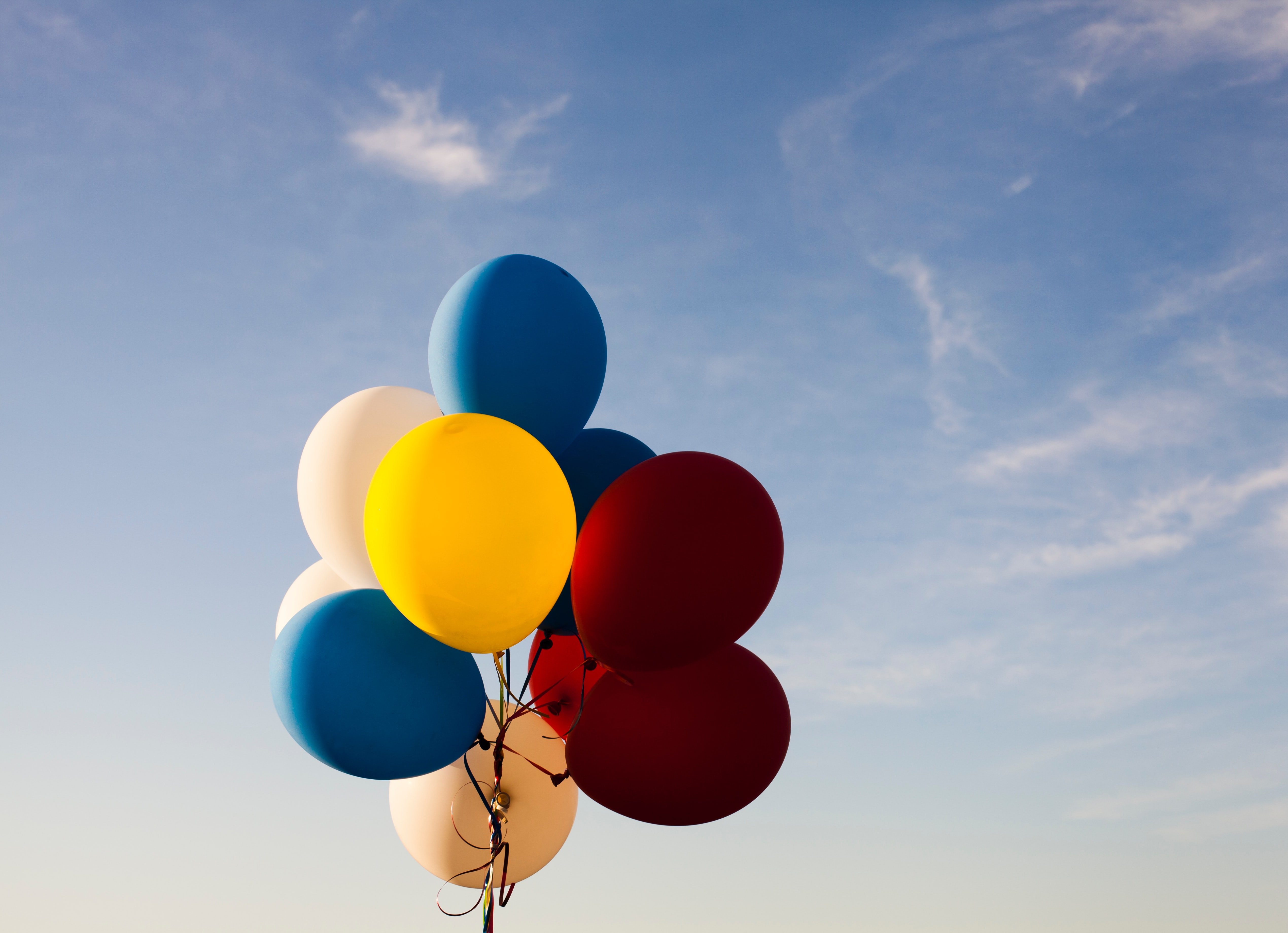 Balloons are often made of plastic, which poses serious environmental concerns - so SAD! Photo by Andreas Weiland on Unsplash